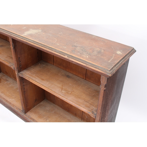 547 - A late-Victorian oak low open bookcase - the moulded top over a two-sided bookcase section, each sid... 