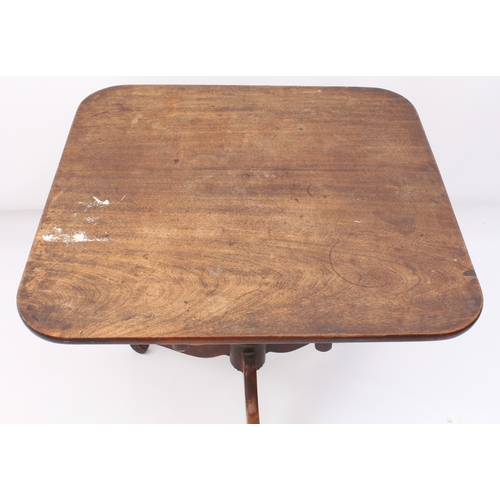 548 - A late-George III mahogany tilt-top tripod supper table - the rectangular top raised on a turned bal... 