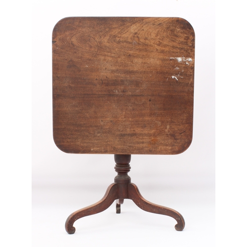 548 - A late-George III mahogany tilt-top tripod supper table - the rectangular top raised on a turned bal... 