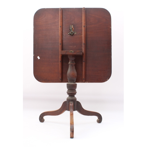 548 - A late-George III mahogany tilt-top tripod supper table - the rectangular top raised on a turned bal... 