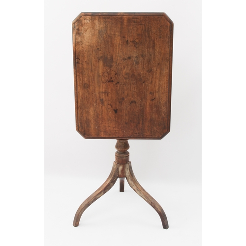 549 - A George III mahogany tilt-top tripod table - the moulded rectangular top with clipped corners, on a... 