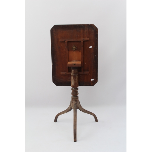 549 - A George III mahogany tilt-top tripod table - the moulded rectangular top with clipped corners, on a... 