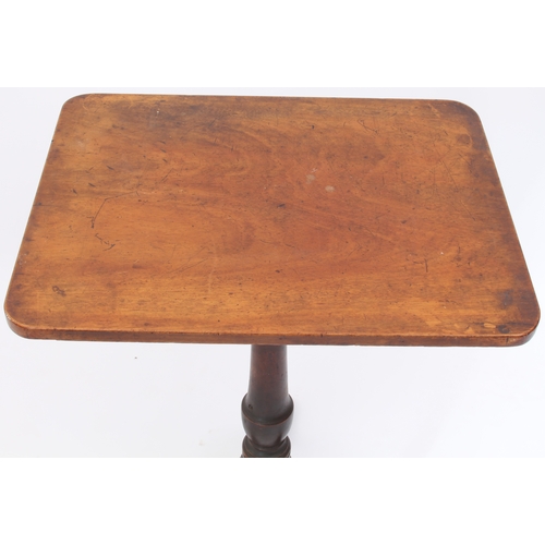 550 - A George III mahogany tilt-top tripod table - the rectangular top on a turned gun-barrel column to t... 