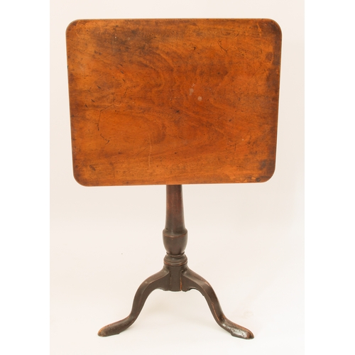 550 - A George III mahogany tilt-top tripod table - the rectangular top on a turned gun-barrel column to t... 