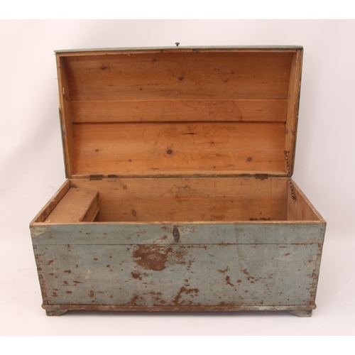 553 - A 19th century painted pine dome-top trunk - in pale blue, with iron carrying handles, the interior ... 