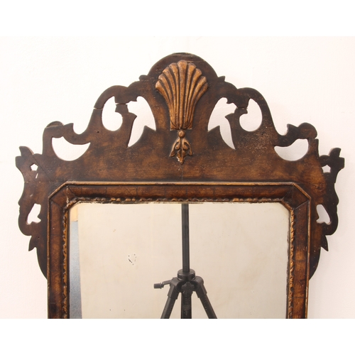 571 - A walnut and parcel-gilt fretwork mirror in George I style - probably 19th century, with gilt shell ... 