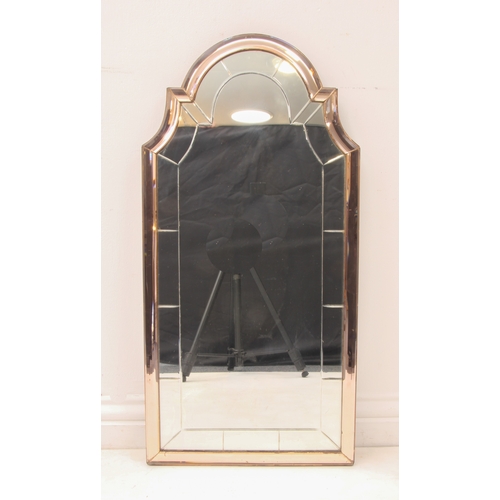 572 - An Art Deco period pink glass mirror - 1930s-40s, the shaped, arched plate with marginal cut decorat... 