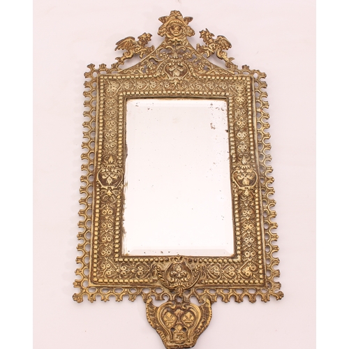 574 - A small cast brass mirror in the Baroque style - late 19th century, the pierced frame with stylised ... 