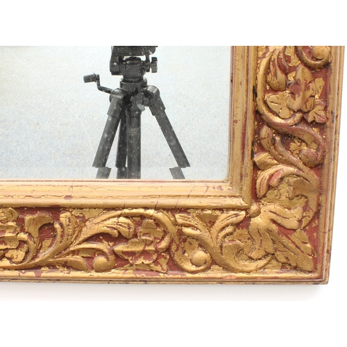 575 - A gilt and composition framed mirror - late 20th century, rectangular with bevelled plate, the frame... 