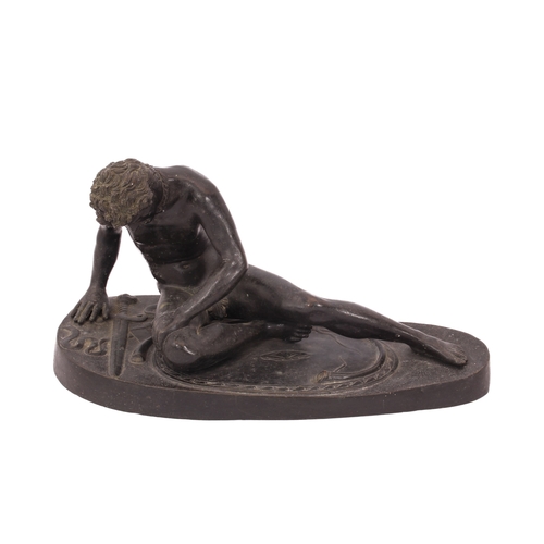 671 - After the antique: a French patinated bronze figure, The Dying Gaul - 19th century, the recumbent fi... 