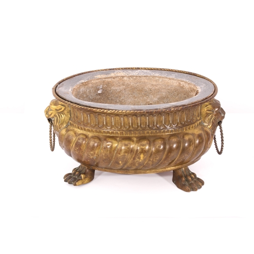 673 - A 19th century style pressed brass jardinière - French, early 20th century, bombé oval form with gad... 