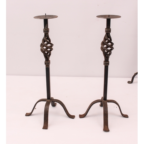 677 - Two pairs of wrought iron candlesticks - the taller 78.75cm high; together with a reproduction Victo... 