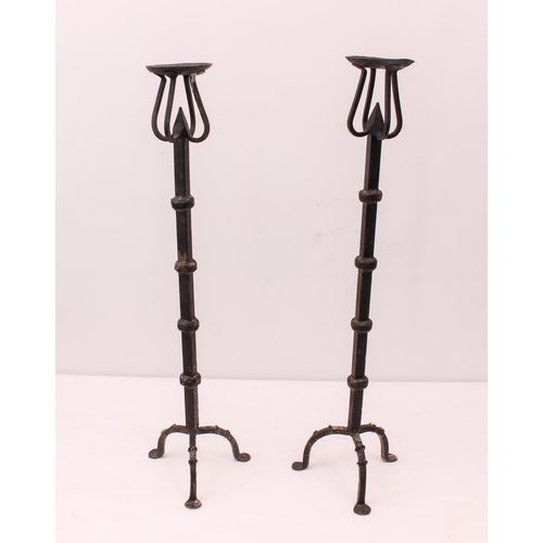 677 - Two pairs of wrought iron candlesticks - the taller 78.75cm high; together with a reproduction Victo... 