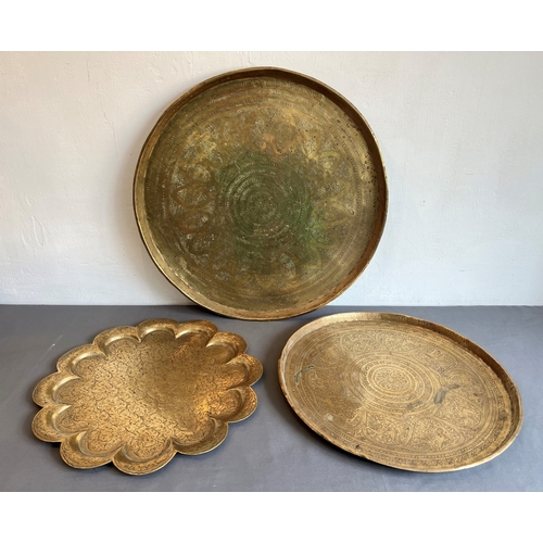 690 - Four North African and Indian brass trays - the largest in copper, Egyptian, first half 20th century... 