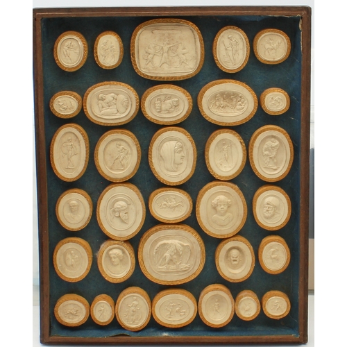 704 - A cased set of Grand Tour plaster intaglios - the thirty-seven intaglios with gilt edged card frames... 