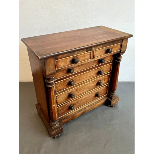 711 - A mid-19th century mahogany apprentice piece miniature chest of drawers - the rectangular top with a... 