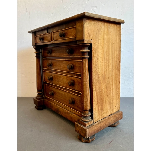 711 - A mid-19th century mahogany apprentice piece miniature chest of drawers - the rectangular top with a... 