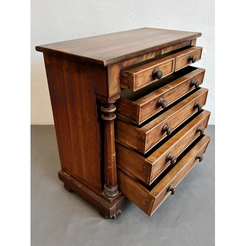 711 - A mid-19th century mahogany apprentice piece miniature chest of drawers - the rectangular top with a... 