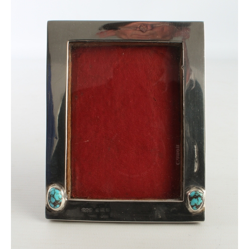 108 - A Liberty silver Arts & Crafts photograph frame set with two natural turquoise cabochon stones, oak ... 