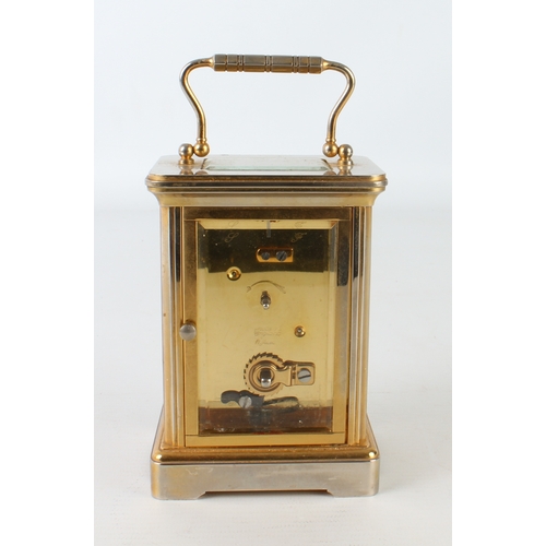 256 - An English Garrard & Co. brass carriage clock - the 11 jewel single train movement signed 'Made in E... 