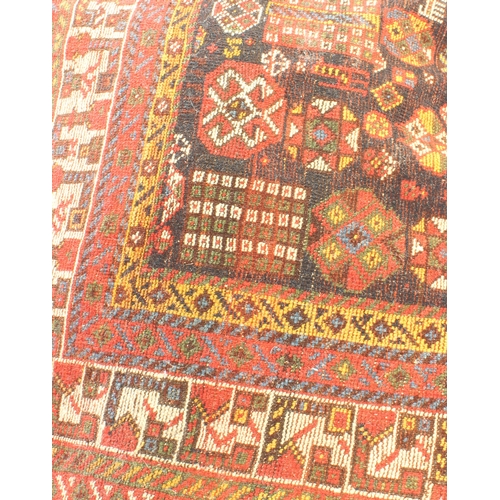 615 - A Qashqai rug - 19th century, the very deep blue ground with dense all over decoration with two huma... 