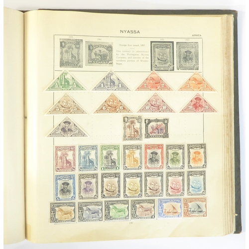 759 - A 'Triumph Stamp Album of the World' - a good collection of GB and world stamps, mostly Victoria to ... 