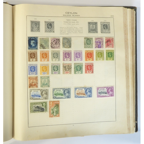 759 - A 'Triumph Stamp Album of the World' - a good collection of GB and world stamps, mostly Victoria to ... 