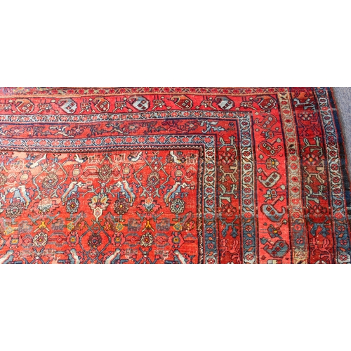 608 - An antique Bijar North-West Persian carpet - c.1870, the central blue large lozenge on a red ground ... 