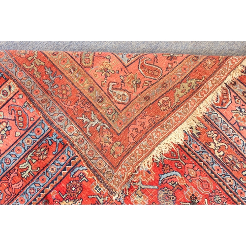 608 - An antique Bijar North-West Persian carpet - c.1870, the central blue large lozenge on a red ground ... 