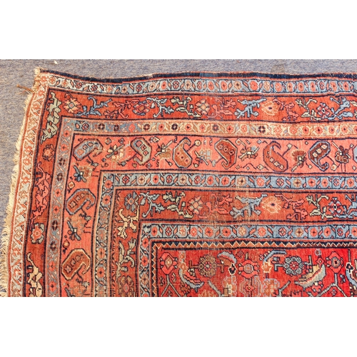 608 - An antique Bijar North-West Persian carpet - c.1870, the central blue large lozenge on a red ground ... 