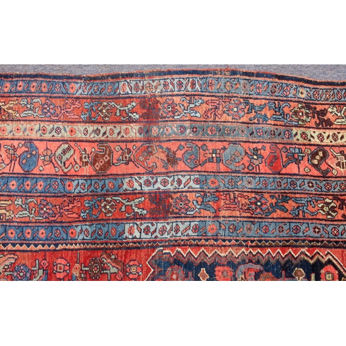 608 - An antique Bijar North-West Persian carpet - c.1870, the central blue large lozenge on a red ground ... 