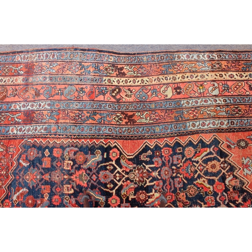 608 - An antique Bijar North-West Persian carpet - c.1870, the central blue large lozenge on a red ground ... 