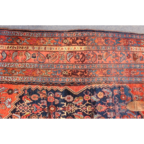 608 - An antique Bijar North-West Persian carpet - c.1870, the central blue large lozenge on a red ground ... 