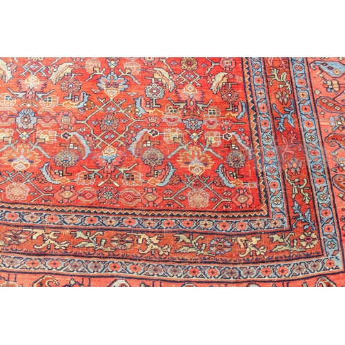 608 - An antique Bijar North-West Persian carpet - c.1870, the central blue large lozenge on a red ground ... 