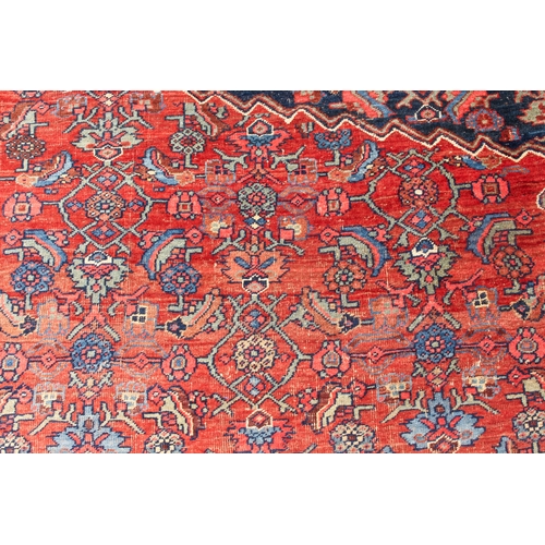 608 - An antique Bijar North-West Persian carpet - c.1870, the central blue large lozenge on a red ground ... 