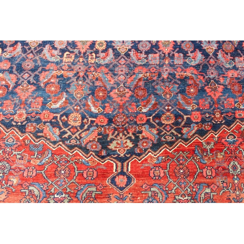 608 - An antique Bijar North-West Persian carpet - c.1870, the central blue large lozenge on a red ground ... 