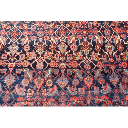 608 - An antique Bijar North-West Persian carpet - c.1870, the central blue large lozenge on a red ground ... 