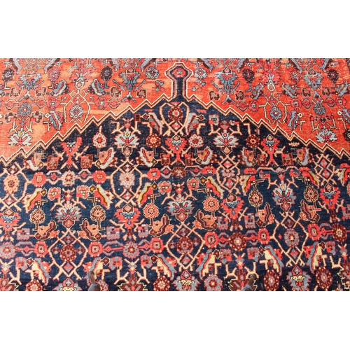 608 - An antique Bijar North-West Persian carpet - c.1870, the central blue large lozenge on a red ground ... 