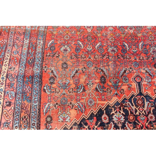 608 - An antique Bijar North-West Persian carpet - c.1870, the central blue large lozenge on a red ground ... 