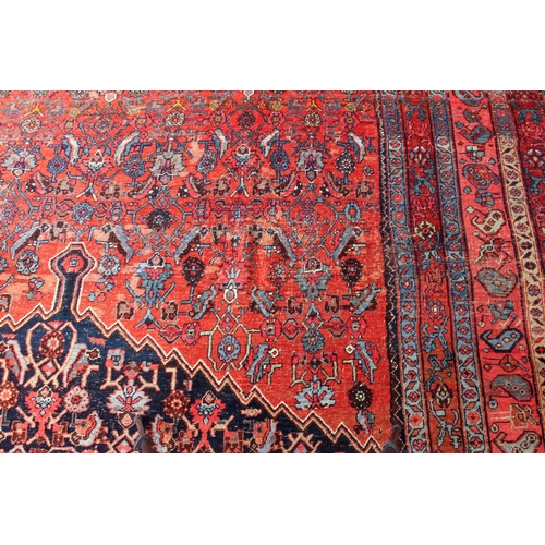 608 - An antique Bijar North-West Persian carpet - c.1870, the central blue large lozenge on a red ground ... 