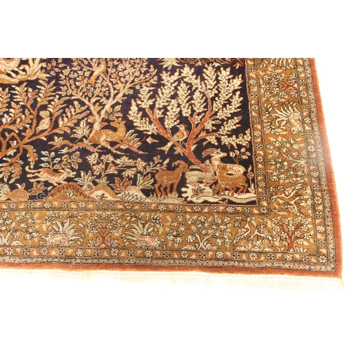 611 - A Turkish Hereke silk tree design rug - late 20th century, the deep blue ground with all over decora... 