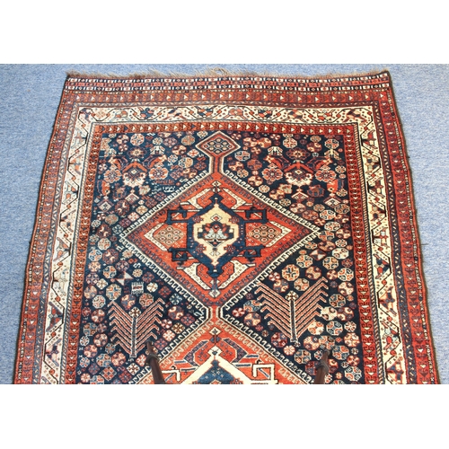 617 - A Khamseh Confederacy rug, South West Persia - last quarter 19th century, with three central lozenge... 