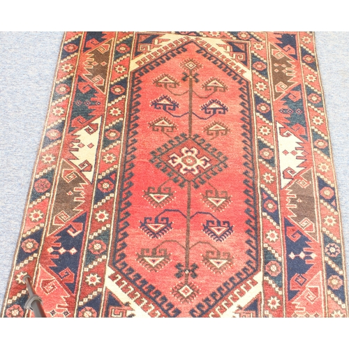 619 - A Turkish hand knotted Dosmealti rug - 20th century, the rose red ground with a central lozenge meda... 