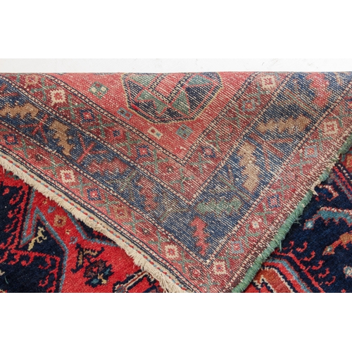 625 - A Kurdish hand knotted wool rug, Persian-Kurdistan - c.1900, the large central chequerboard lozenge ... 