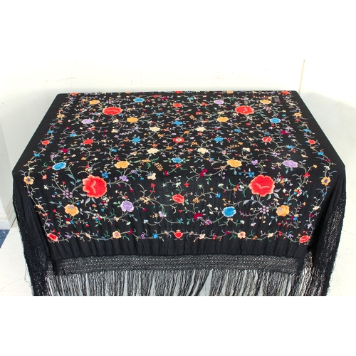 650 - An early 20th century Chinese silk embroidered piano shawl - richly decorated with flowers and folia... 