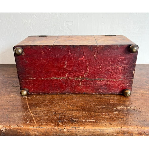 716 - A Regency tortoiseshell tea caddy - rectangular with domed lid and silver metal stringing, on bun fe... 