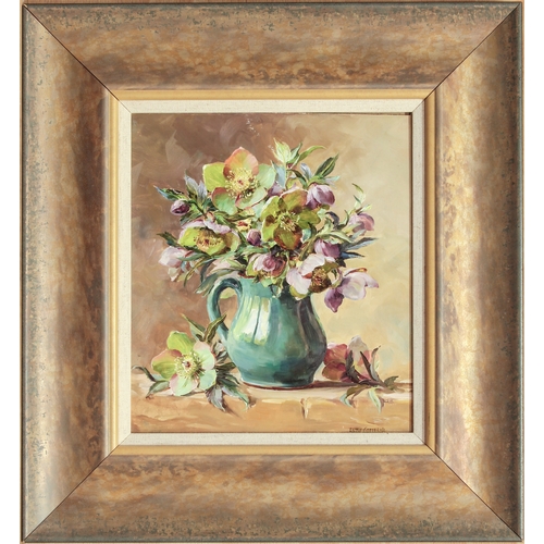 337 - Anne Cotterill (British, 1933-2010)
 Hellebores in a green jug
 oil on board, signed
 10 x 8½in