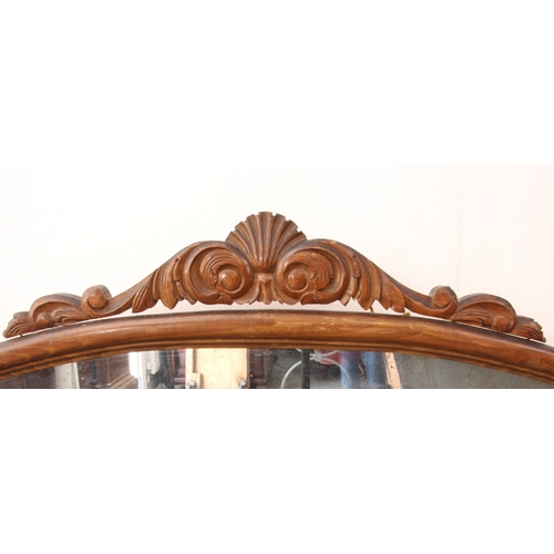 567 - A French beech framed overmantel mirror - 1920s-30s, of cartouche form, with carved foliate and shel... 