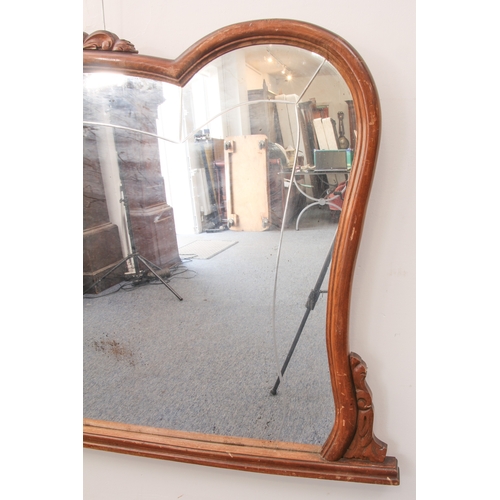 567 - A French beech framed overmantel mirror - 1920s-30s, of cartouche form, with carved foliate and shel... 