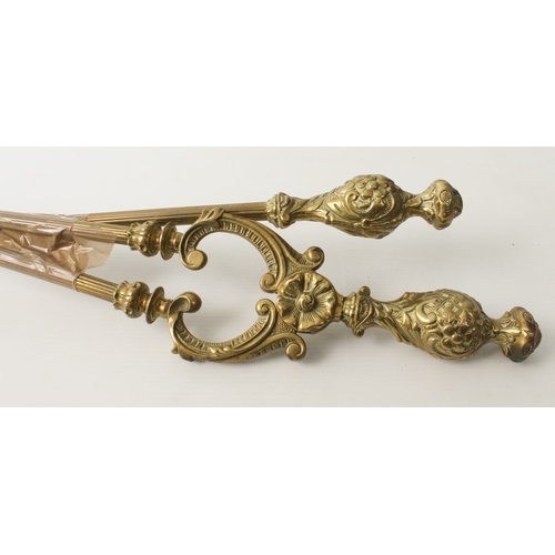 676 - A group of eight brass, polished steel and wrought iron fire irons - including a set of 19th century... 